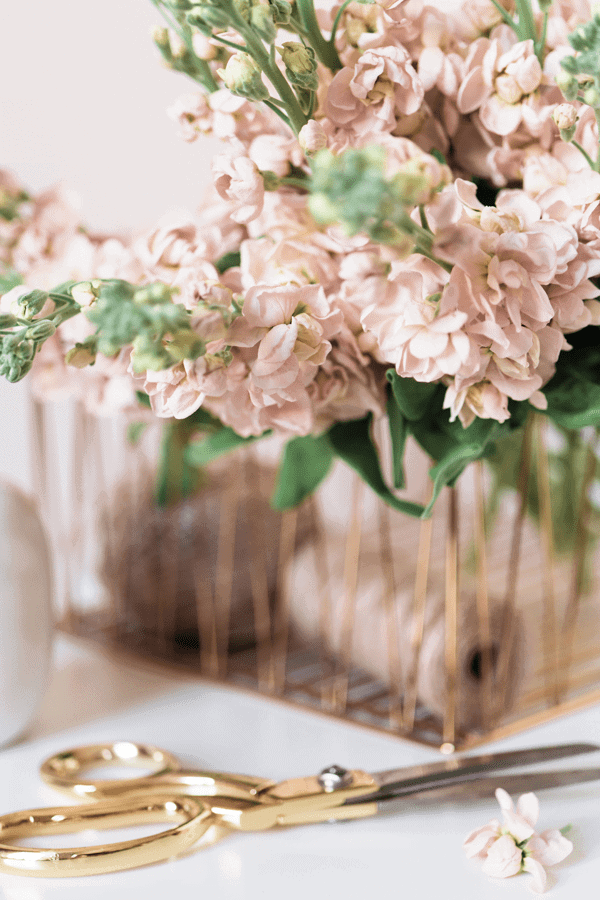 gold scissors and basket of blush roses
