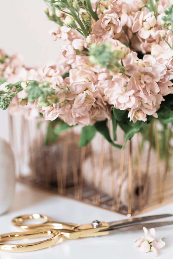 gold scissors and basket of blush roses