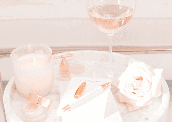 Soft pink candle and wine