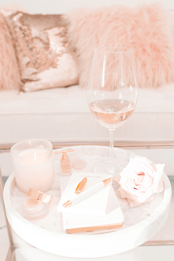 Soft pink candle and wine